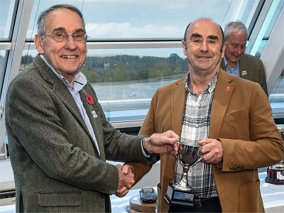 2024 Champion Andrew Webber receives the trophy from Simon Taylor